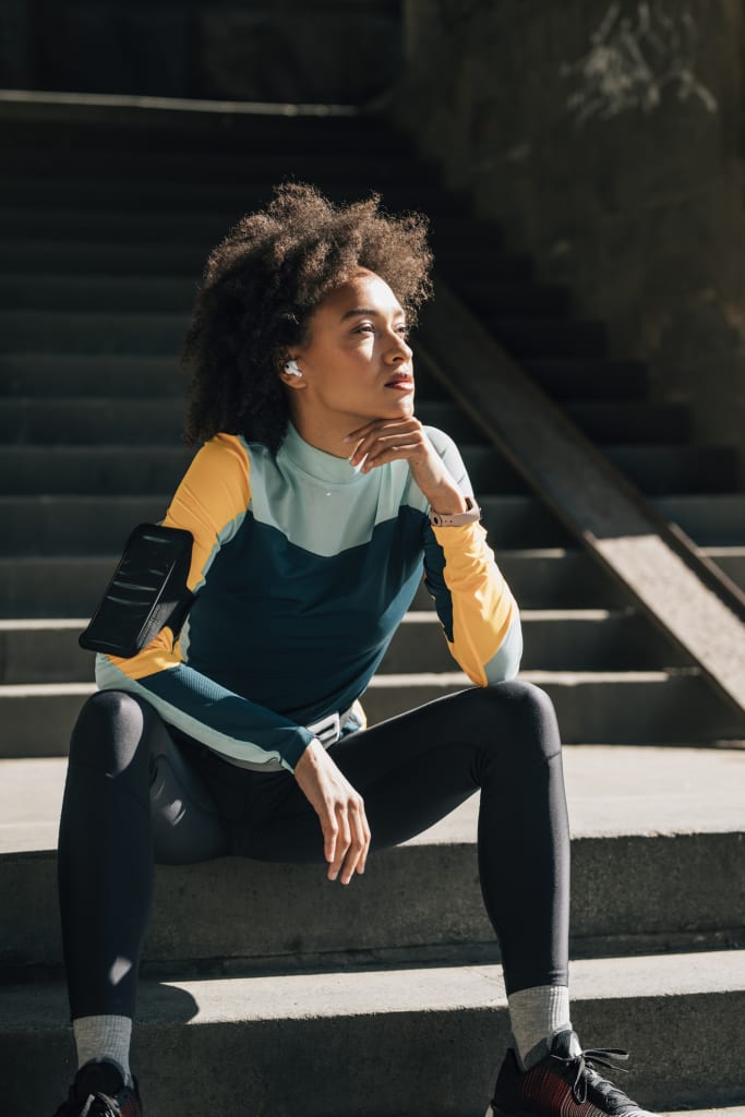 Future of wellness trend fit woman with wellness tech